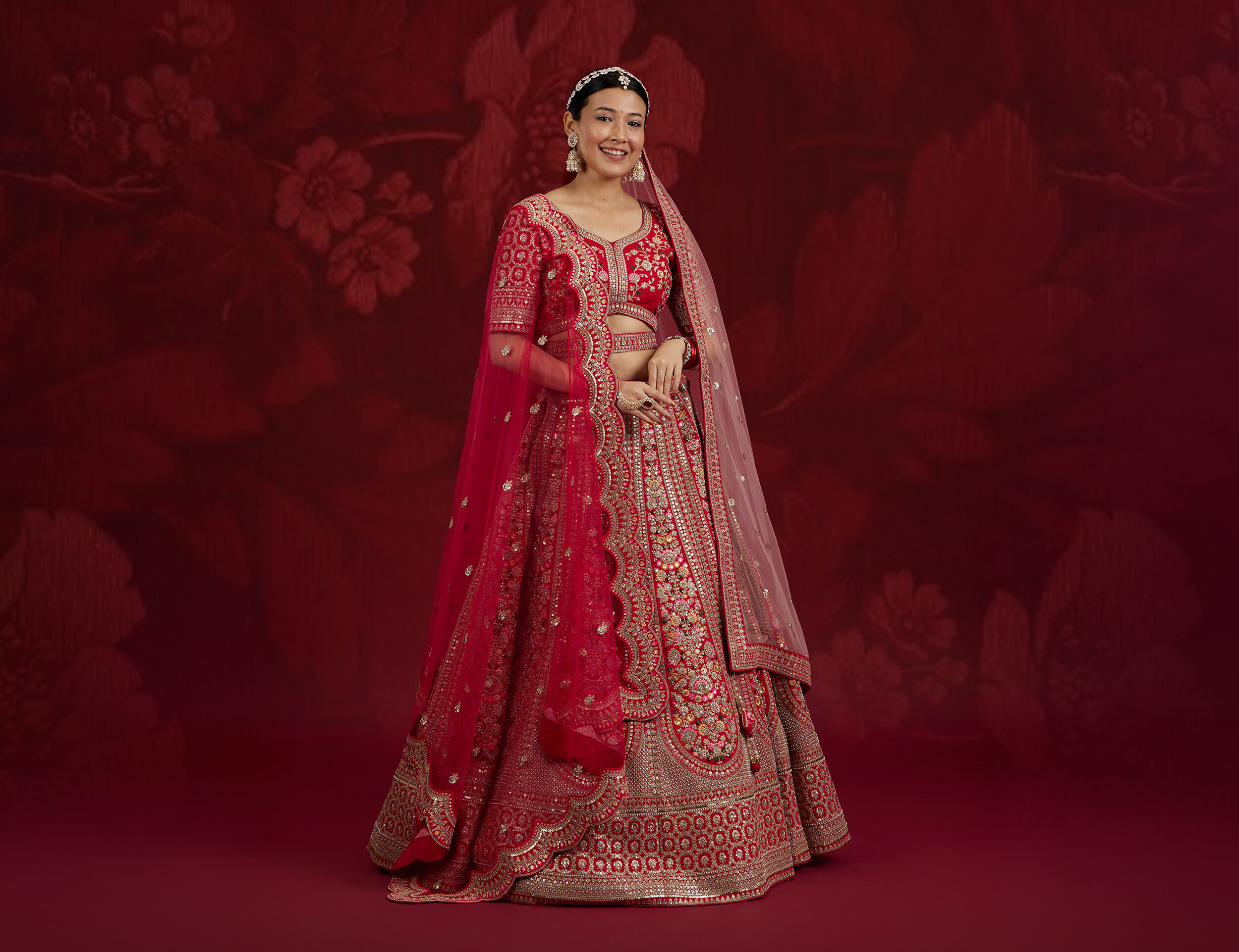 Bride wearing modern fashionable pink lehenga